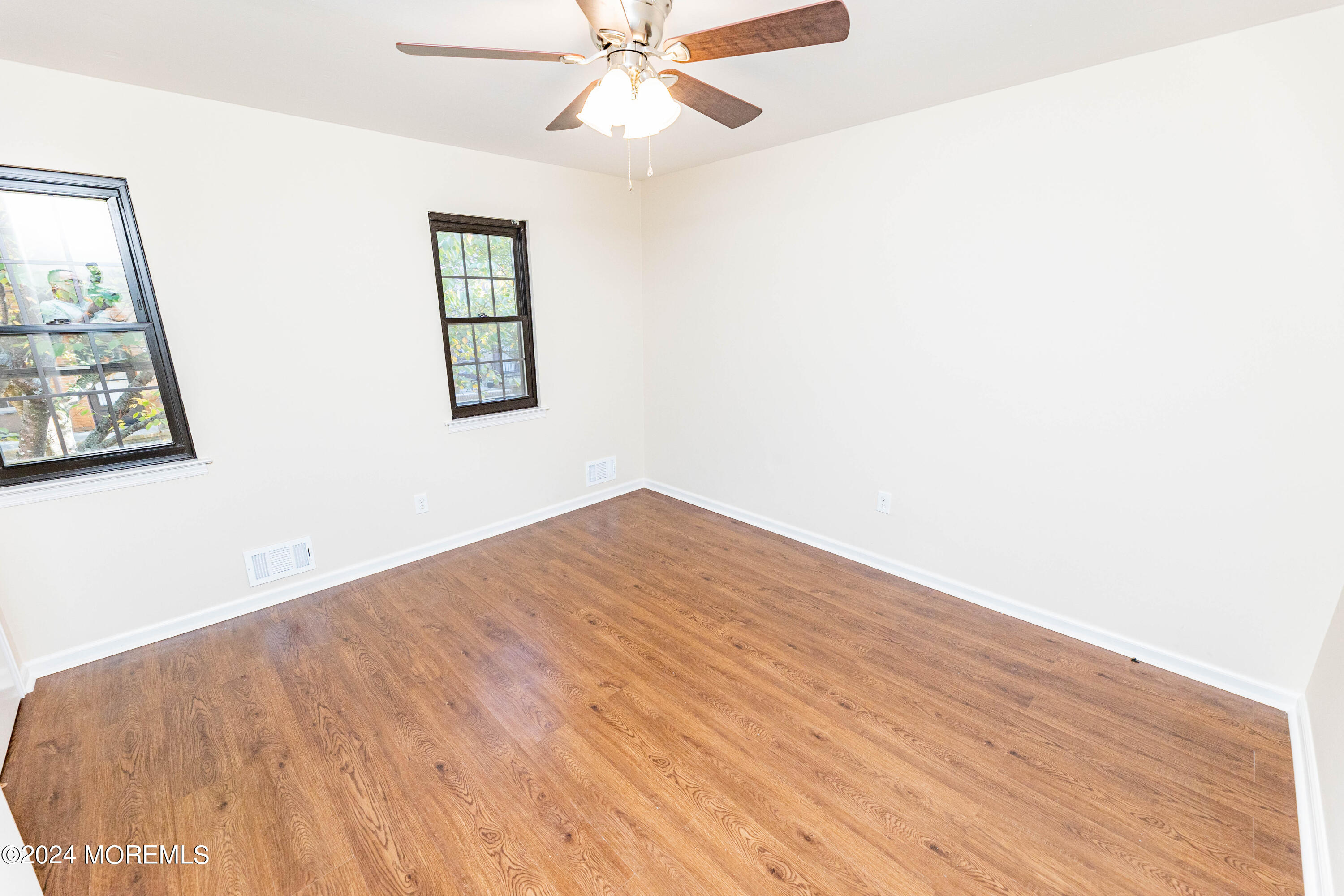 301 Spring Street, Unit 11 Red Bank, NJ 07701 - Photo 21 of 40 a view of empty room with wooden floor