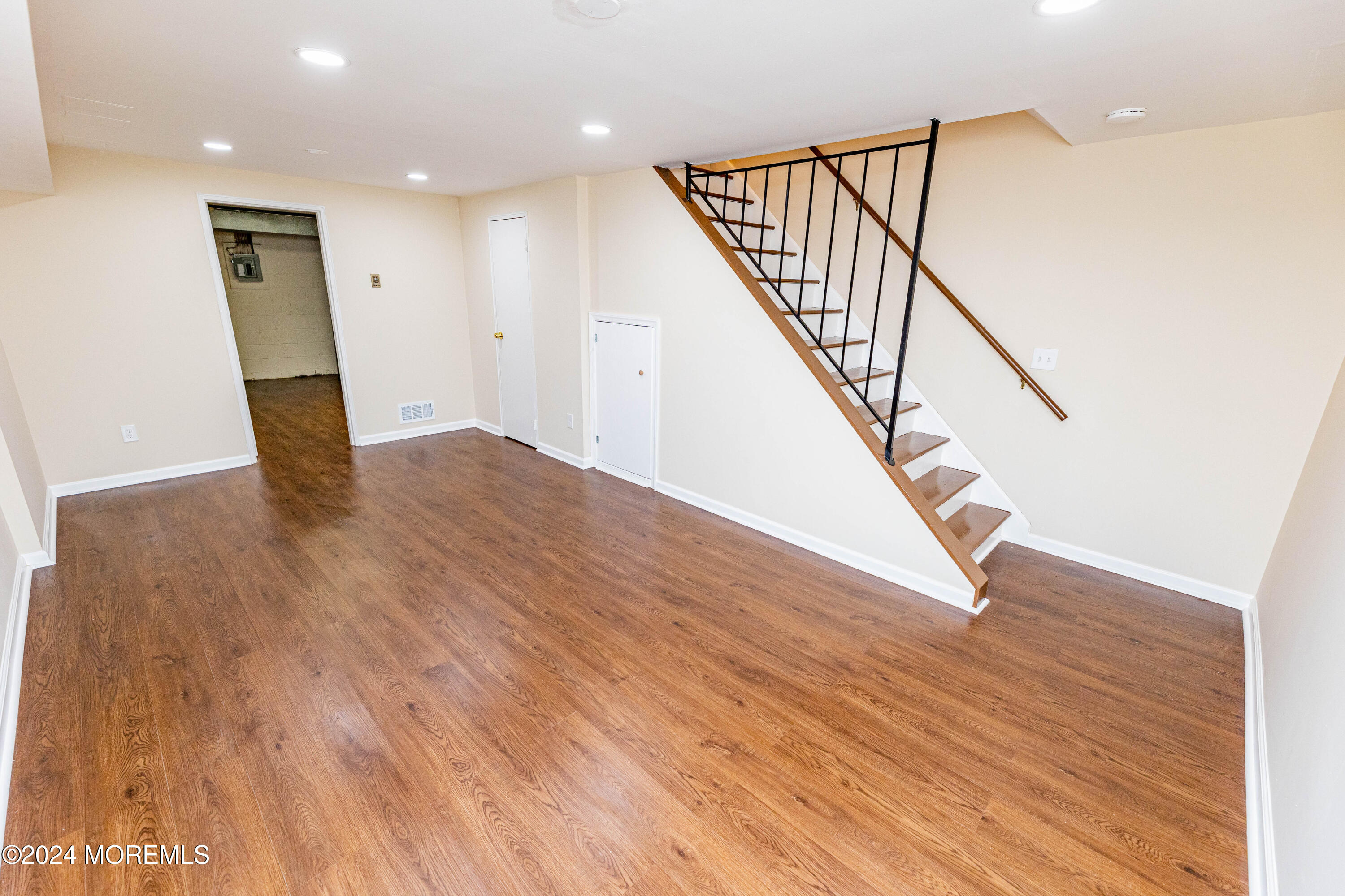 301 Spring Street, Unit 11 Red Bank, NJ 07701 - Photo 30 of 40 a view of entryway and hall with wooden floor