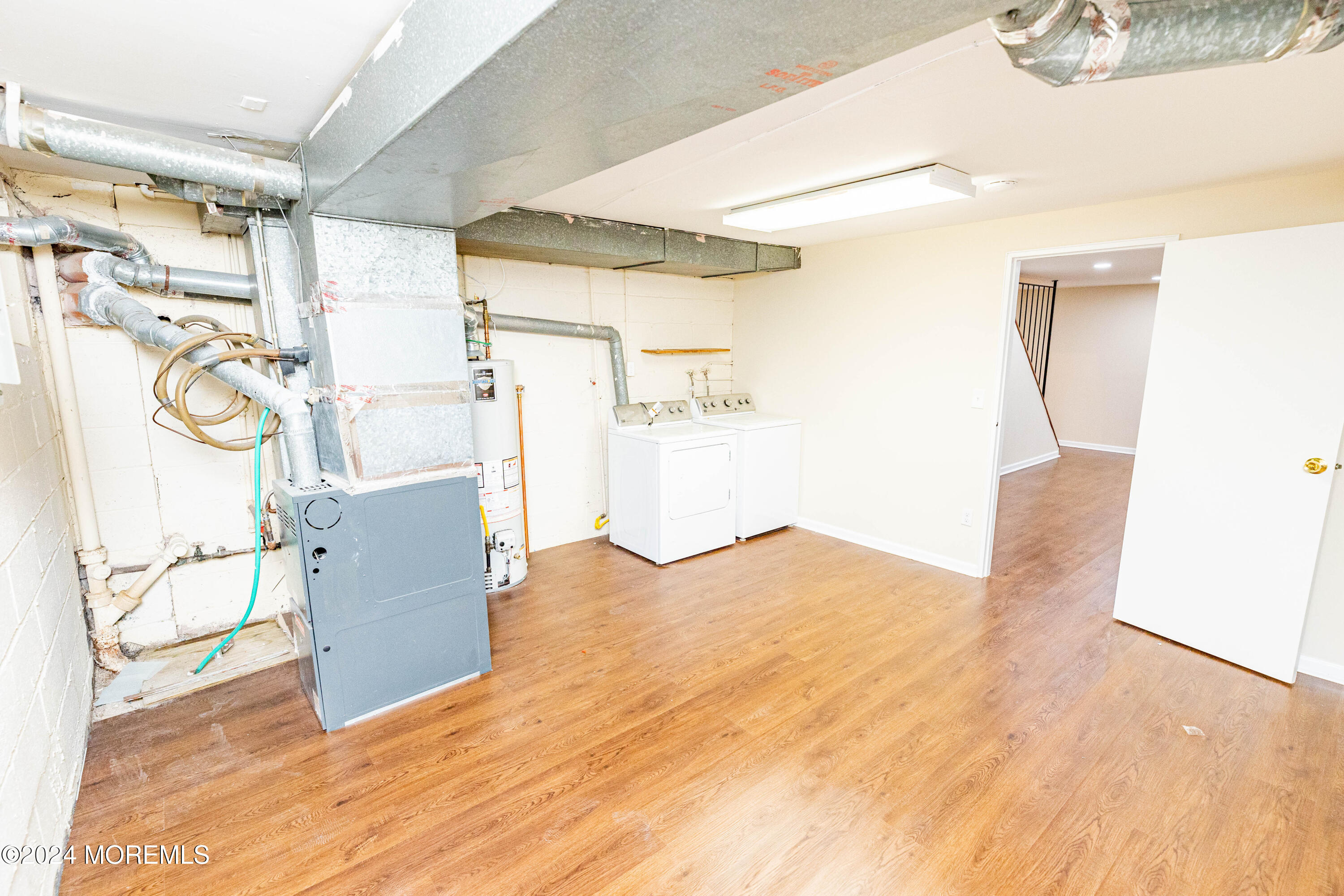 301 Spring Street, Unit 11 Red Bank, NJ 07701 - Photo 34 of 40 a view of a kitchen with a refrigerator and a window
