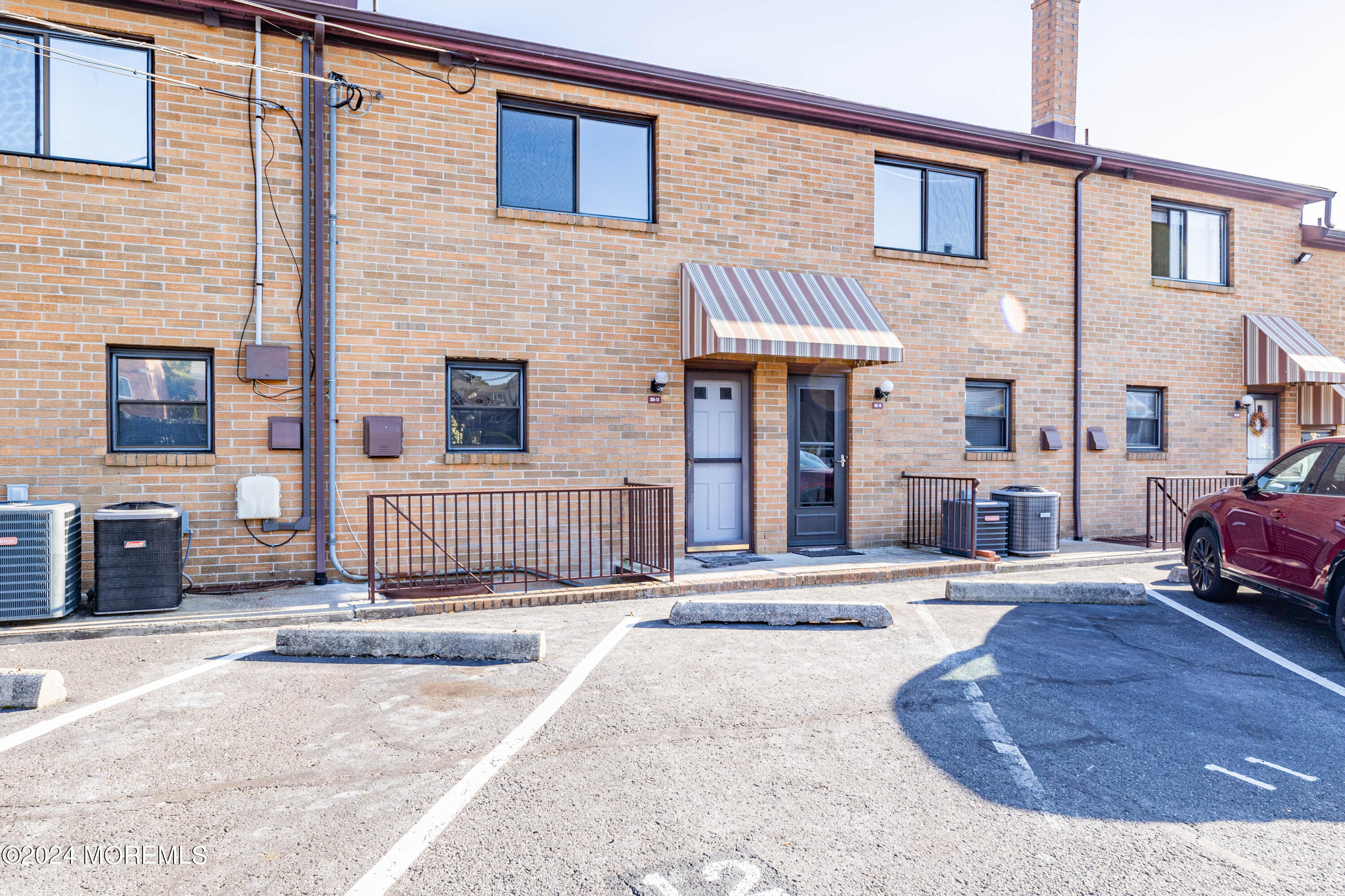 301 Spring Street, Unit 11 Red Bank, NJ 07701 - Photo 38 of 40 a view of a house with a patio