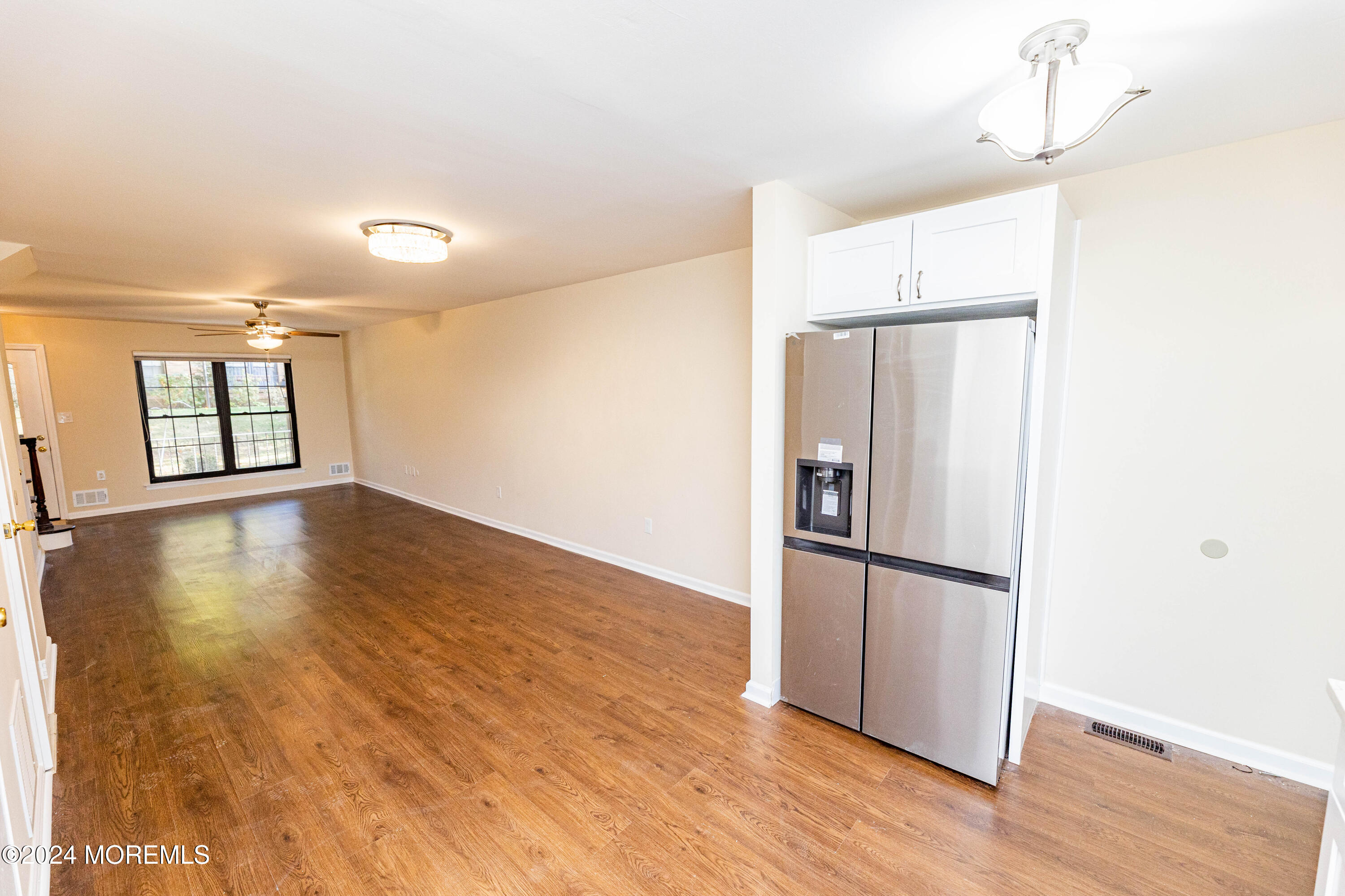 301 Spring Street, Unit 11 Red Bank, NJ 07701 - Photo 10 of 40 a kitchen with a refrigerator and a window