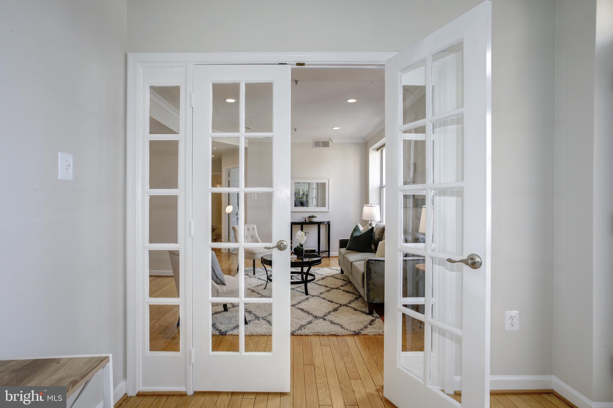 1619 R Street Northwest, Unit 404 Washington, DC 20009 - Photo 11 of 24 view of living room with wooden floor and white walls