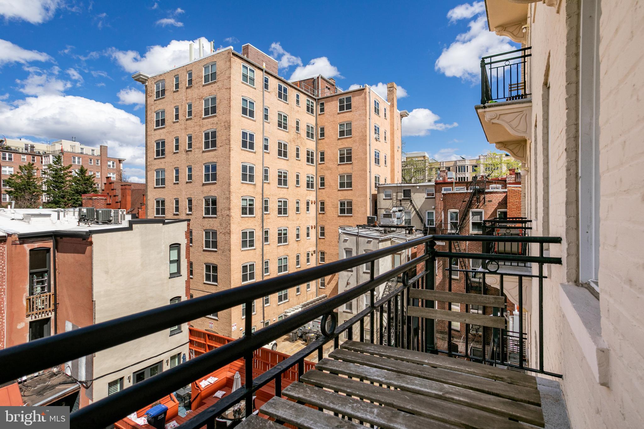 1619 R Street Northwest, Unit 404 Washington, DC 20009 - Photo 16 of 24 a view of a building from a balcony