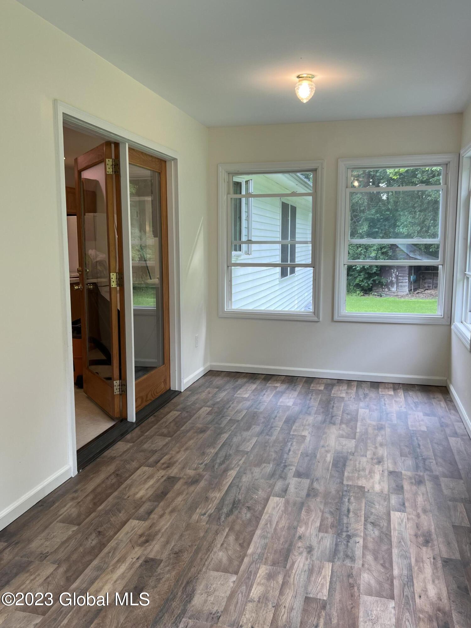 327 Buckley Road Whitehall, NY 12887 - Photo 25 of 38 Three-Season Room w/FR Door Entry