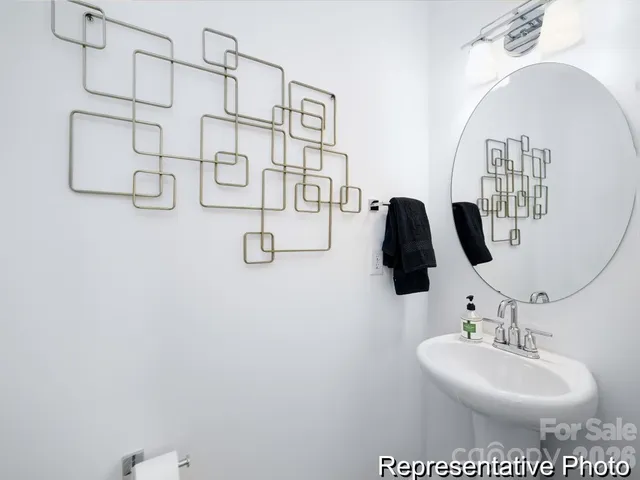 a bathroom with a sink and mirror