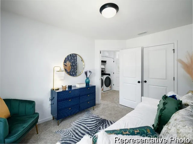 a bedroom with a bed and a dresser