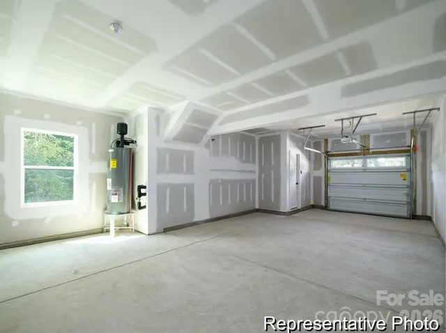 an empty room with fireplace and windows