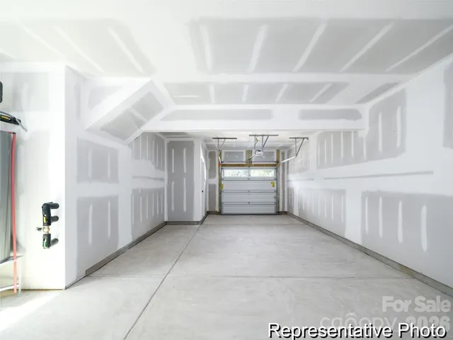 a view of an empty room with a fireplace