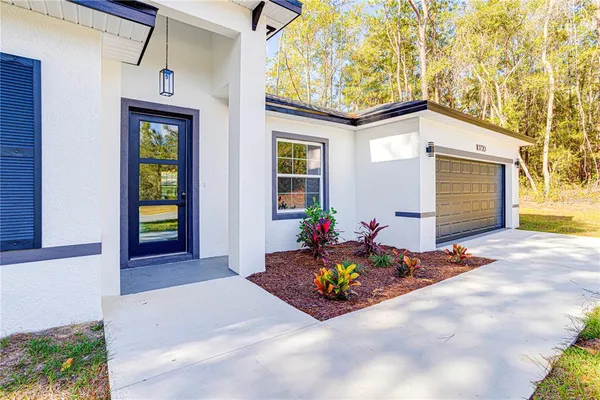 a front view of house with an outdoor space