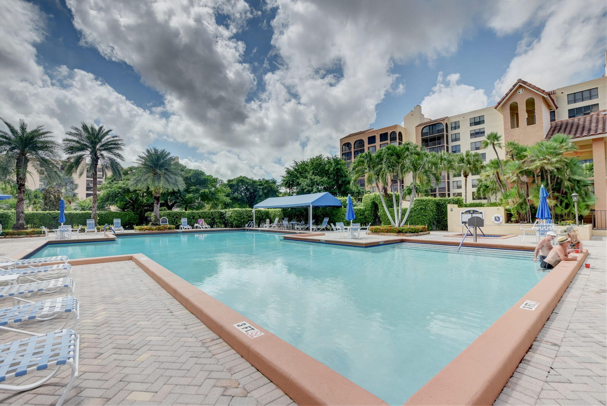 7194 Promenade Drive, Unit 102 Boca Raton, FL 33433 - Photo 48 of 56 a view of a swimming pool with a patio