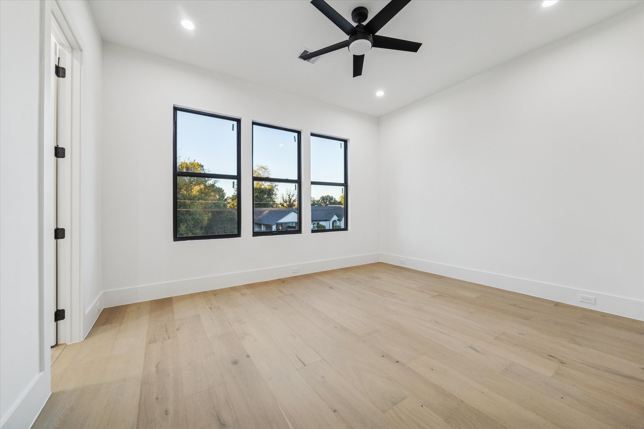 614 Eleanor Street Houston, TX 77009 - Photo 28 of 38 wooden floor in an empty room with a window