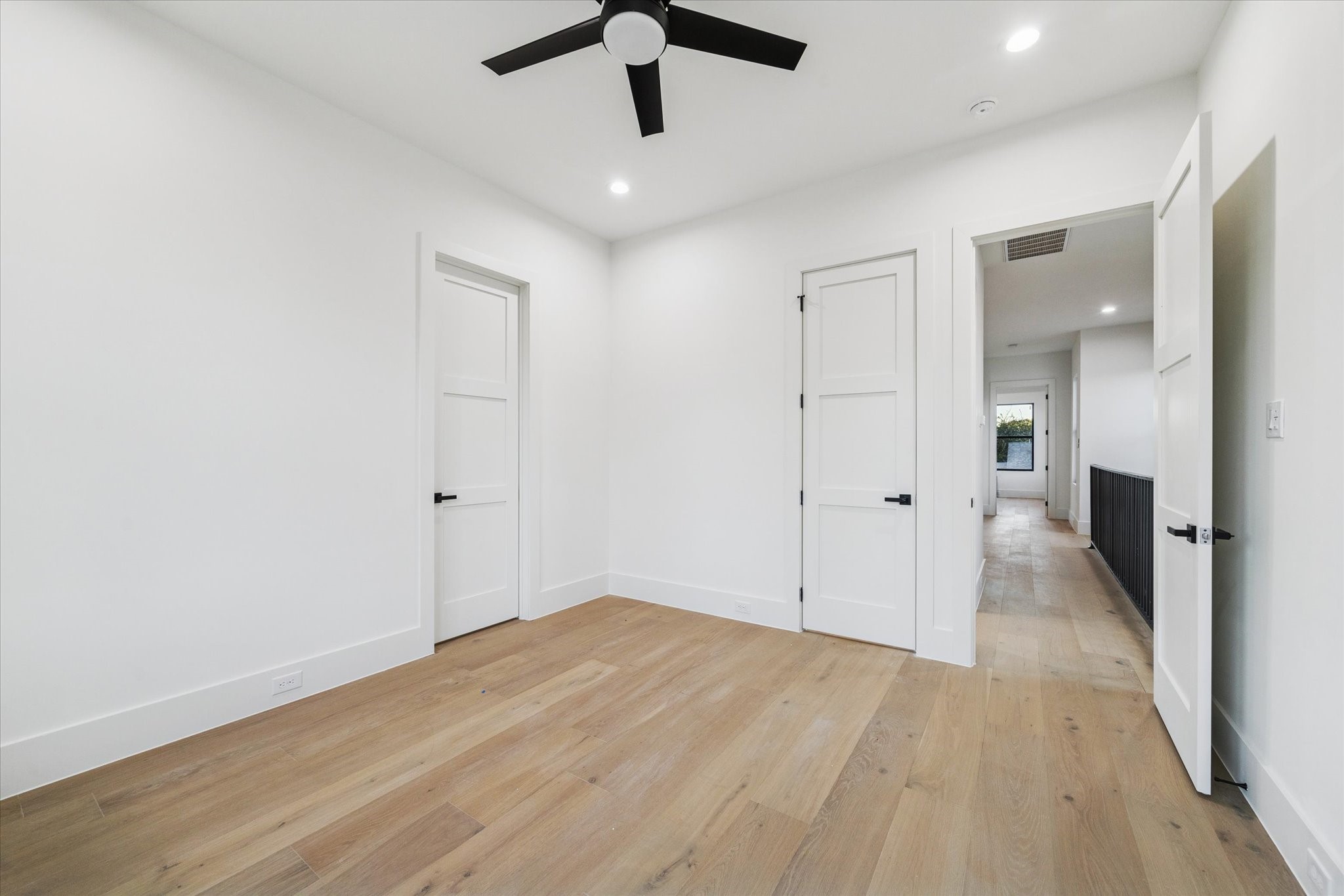 614 Eleanor Street Houston, TX 77009 - Photo 32 of 38 an empty room with wooden floor and windows