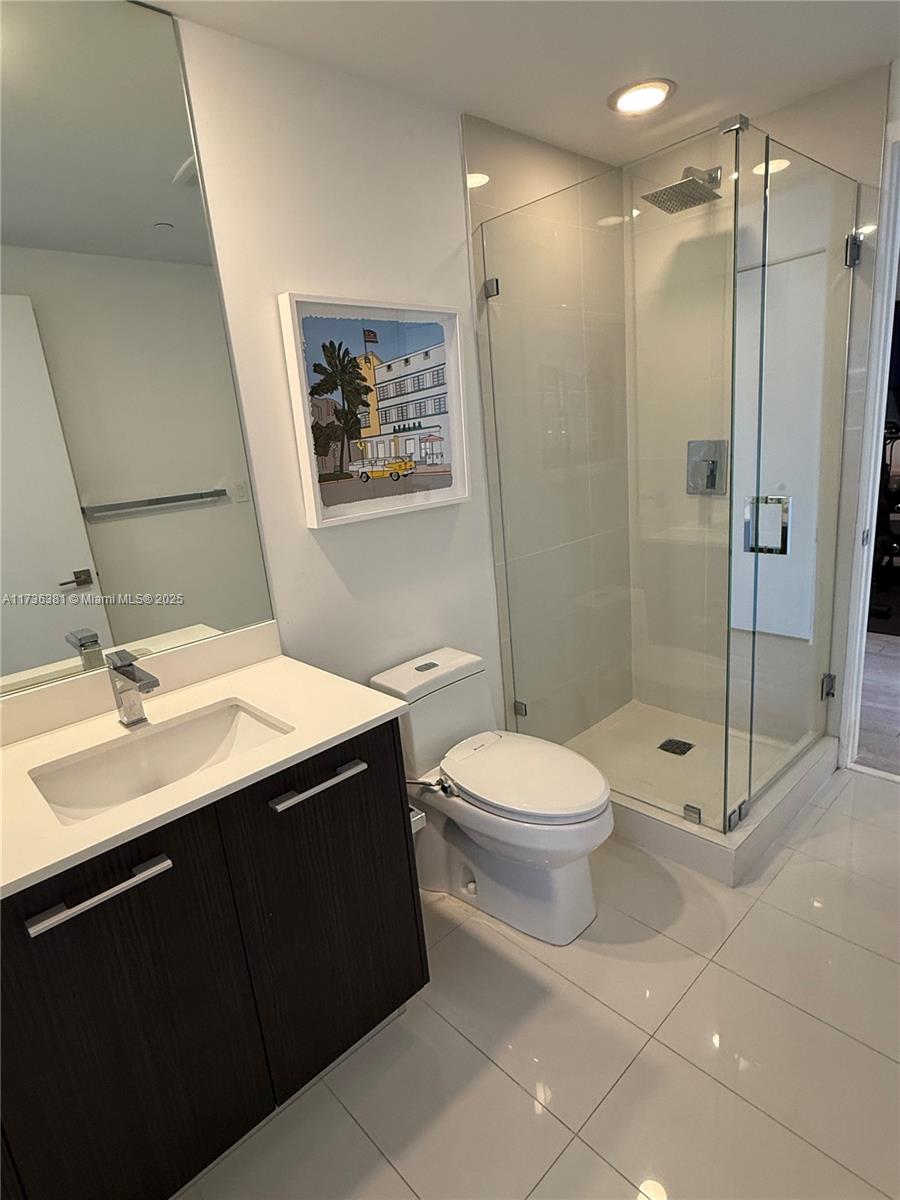55 Southwest 9th Street, Unit 1701 Miami, FL 33130 - Photo 12 of 58 a bathroom with a sink toilet and shower