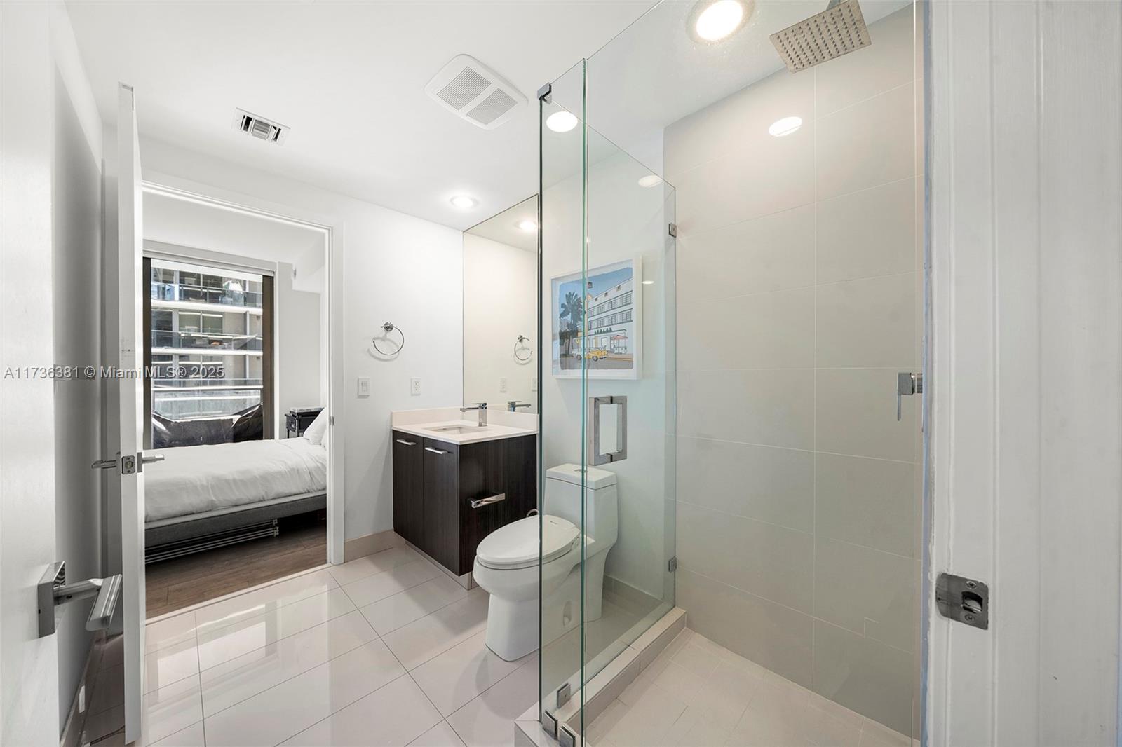 55 Southwest 9th Street, Unit 1701 Miami, FL 33130 - Photo 24 of 58 a en suite bathroom with a shower