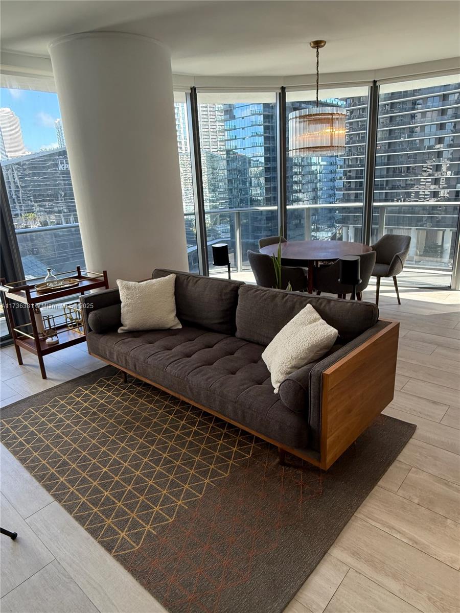55 Southwest 9th Street, Unit 1701 Miami, FL 33130 - Photo 28 of 58 a living room with furniture and floor to ceiling window