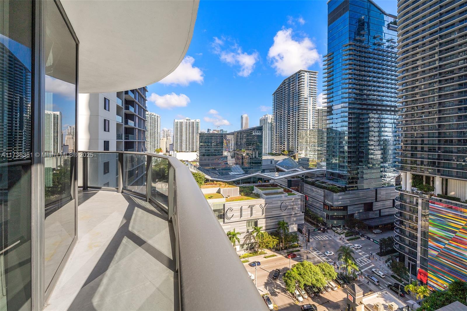55 Southwest 9th Street, Unit 1701 Miami, FL 33130 - Photo 33 of 58 a view of a balcony with dining table and chairs