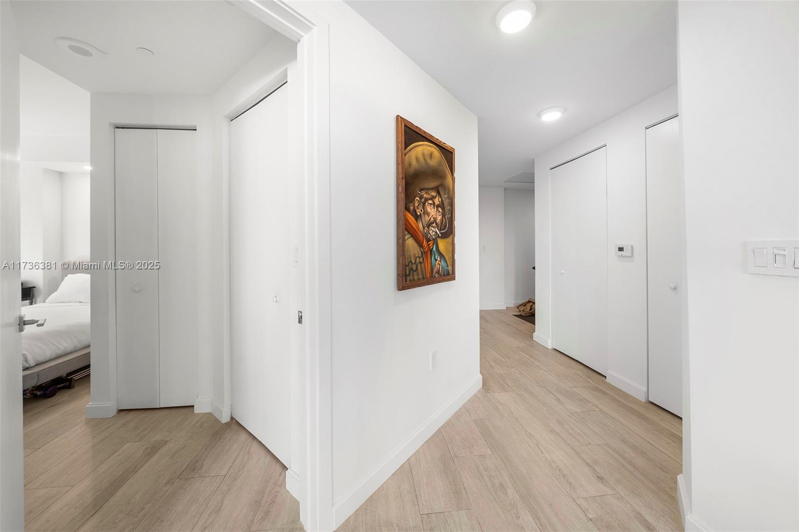 55 Southwest 9th Street, Unit 1701 Miami, FL 33130 - Photo 36 of 58 a view of hallway with wooden floor