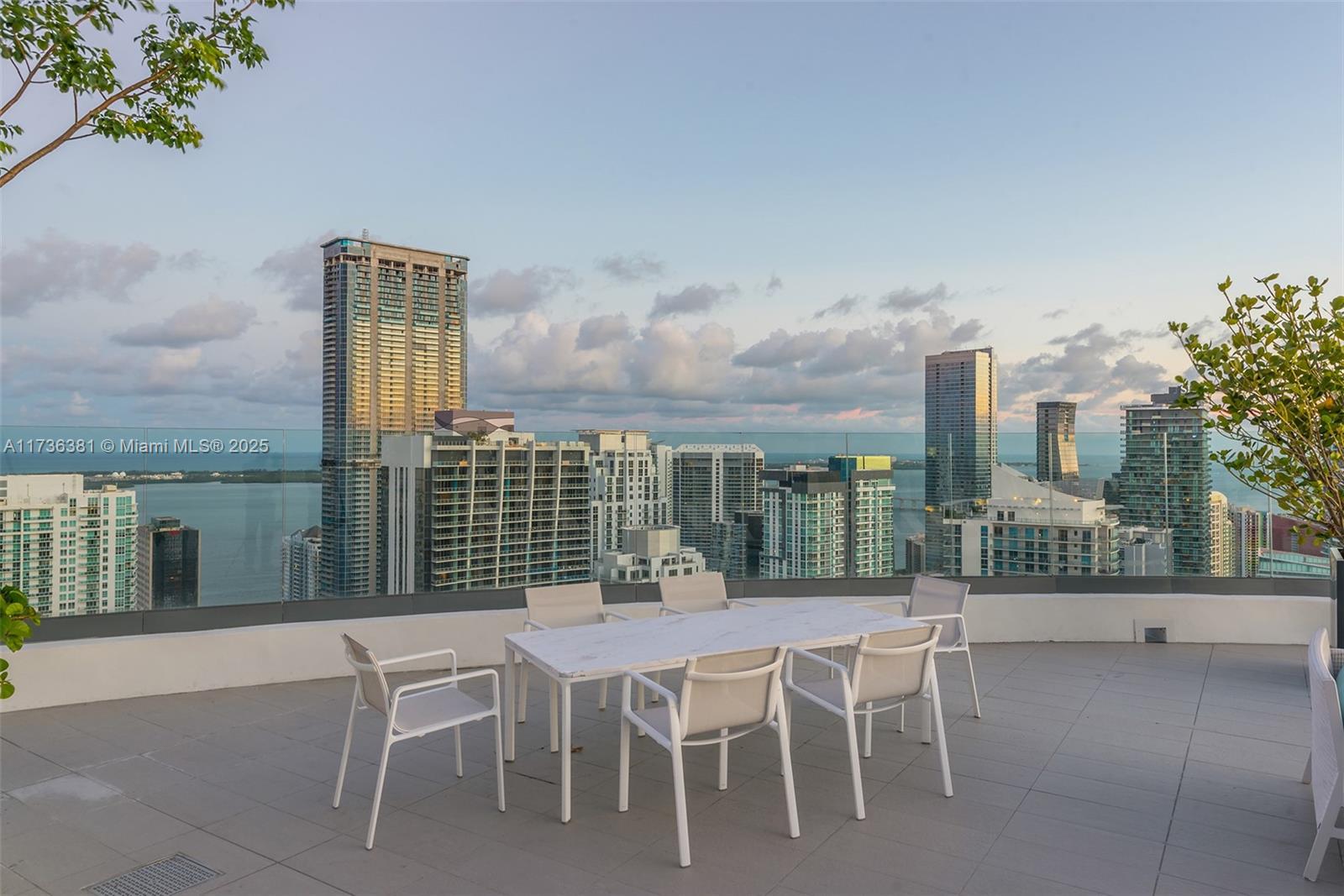 55 Southwest 9th Street, Unit 1701 Miami, FL 33130 - Photo 39 of 58 a dining area with a large window and table