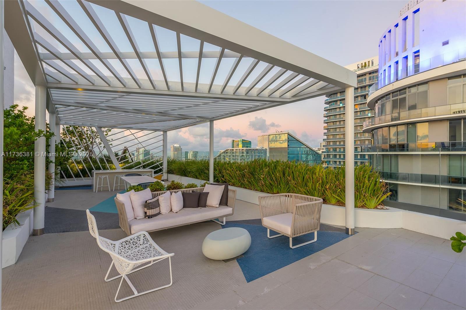 55 Southwest 9th Street, Unit 1701 Miami, FL 33130 - Photo 40 of 58 a outdoor living space with furniture and garden view