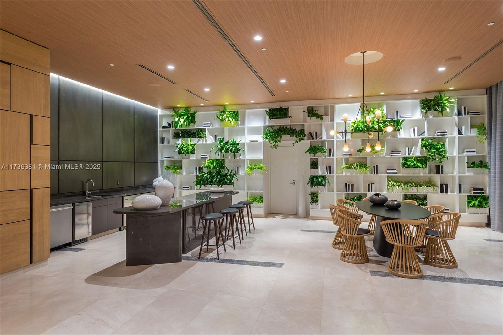 55 Southwest 9th Street, Unit 1701 Miami, FL 33130 - Photo 50 of 58 a dining room with furniture and a potted plant