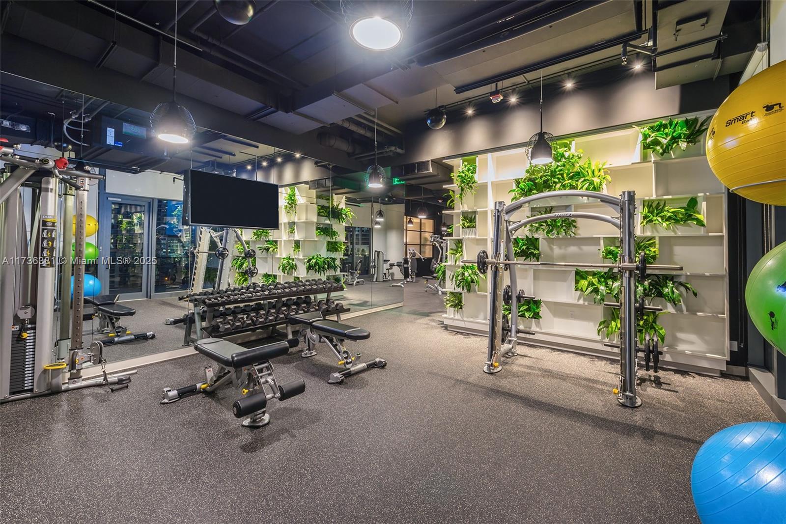 55 Southwest 9th Street, Unit 1701 Miami, FL 33130 - Photo 53 of 58 a room with gym equipment