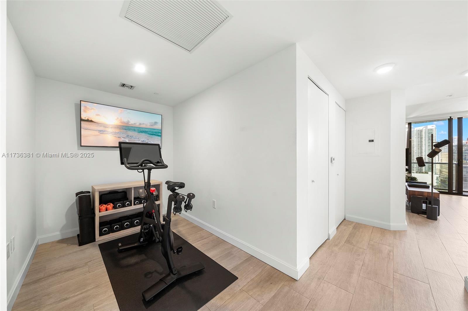 55 Southwest 9th Street, Unit 1701 Miami, FL 33130 - Photo 10 of 58 a view of a livingroom with furniture and a flat screen tv