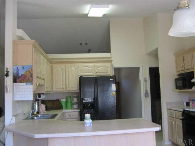 4921 Guernsey Road Pace, FL 32571 - Photo 18 of 22 And the breakfast bar adds to the casual lifestyle of this home.
