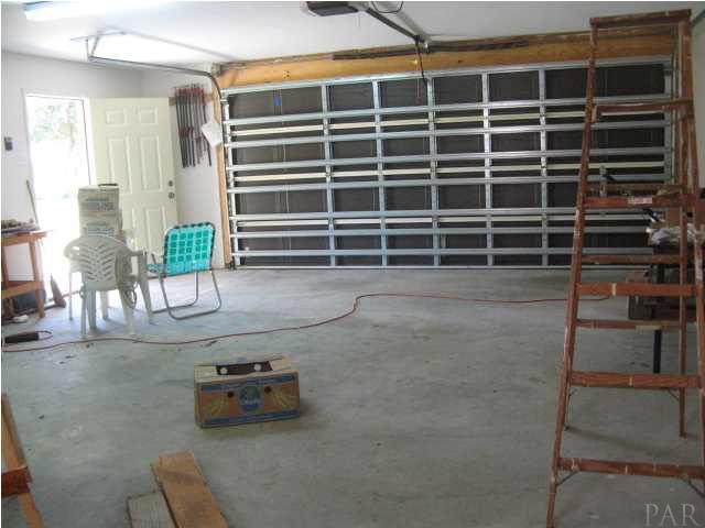 4921 Guernsey Road Pace, FL 32571 - Photo 9 of 22 The building comes with electricity, water, insulated walls, concrete floors, windows built to withstand 140 mps winds...