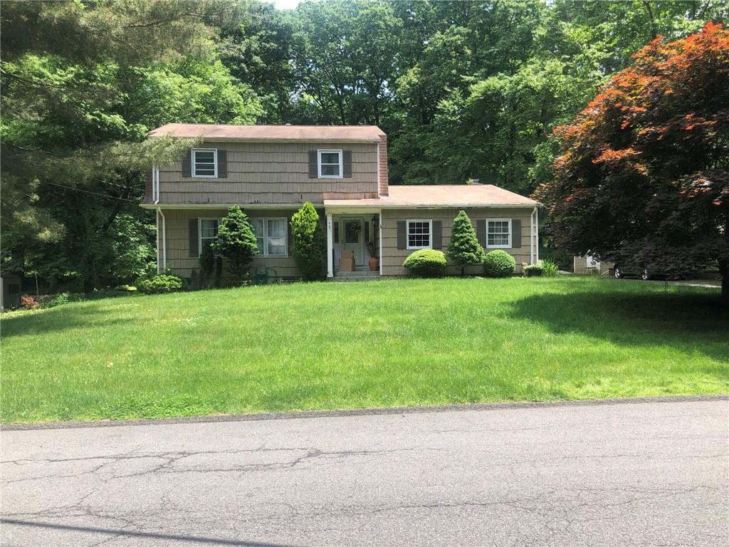 4 Perth Avenue Chestnut Ridge, NY 10977 - Photo 1 of 1 a front view of a house with a garden