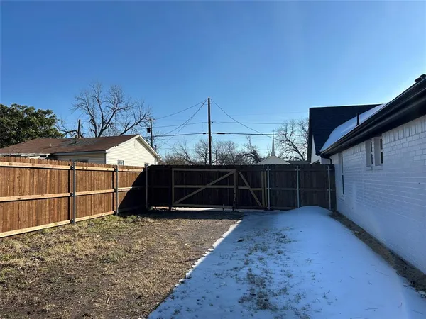 a view of backyard with small cabin