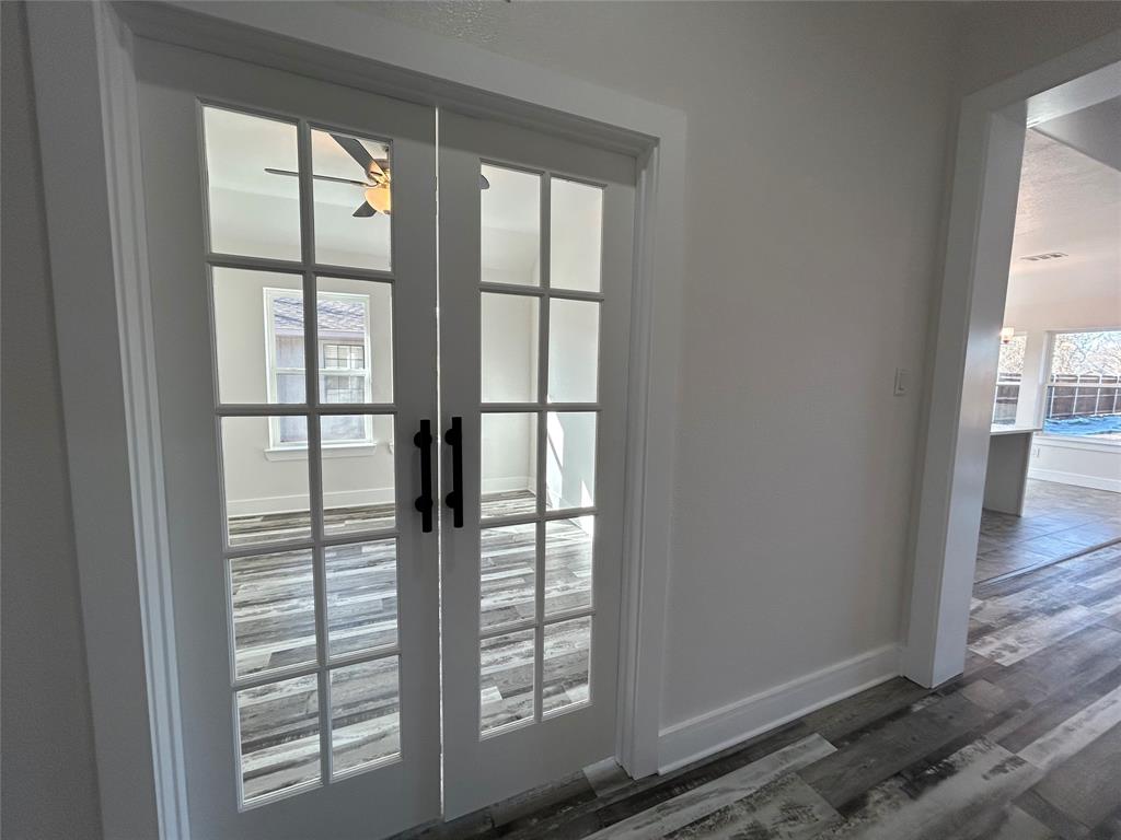 802 South Medora Street Terrell, TX 75160 - Photo 6 of 34 a view of empty room with wooden floor and fan