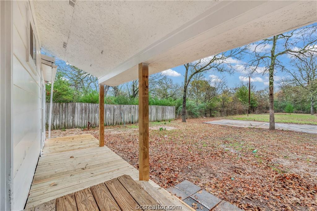 3755 West Villa Maria Road Bryan, TX 77807 - Photo 19 of 26 Fenced along the side of the backyard with a wooden deck