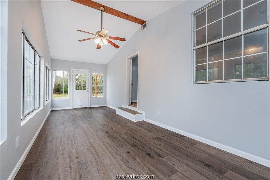 3755 West Villa Maria Road Bryan, TX 77807 - Photo 22 of 26 Unfurnished sunroom with vaulted ceiling with beams
