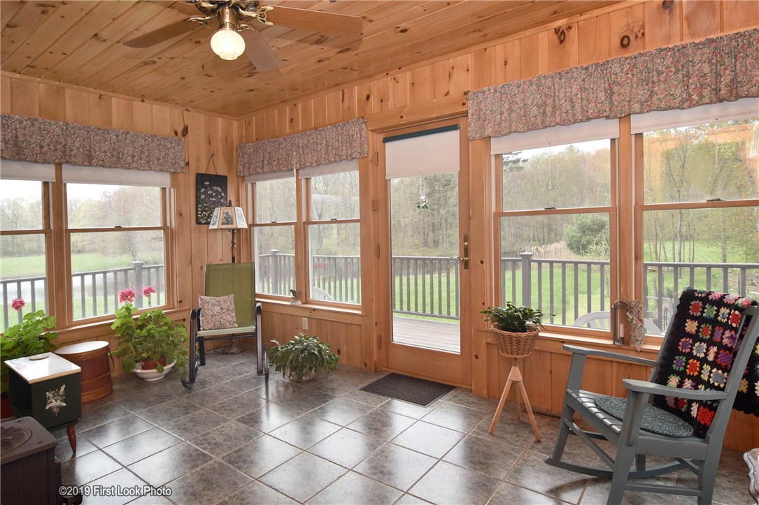 110 South Killingly Road Foster, RI 02825 - Photo 18 of 35 Sunroom/den area with wood stove