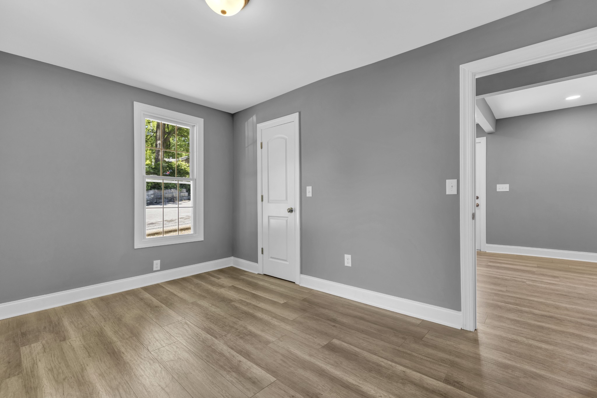 223 East 4th Avenue Springfield, TN 37172 - Photo 11 of 13 wooden floor in an empty room with a window