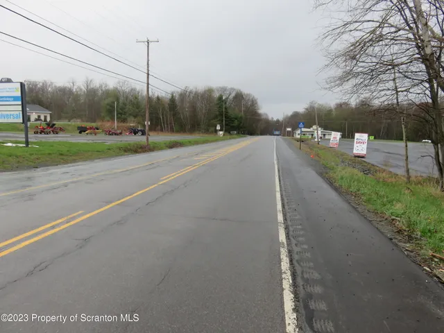 a view of a road with a yard