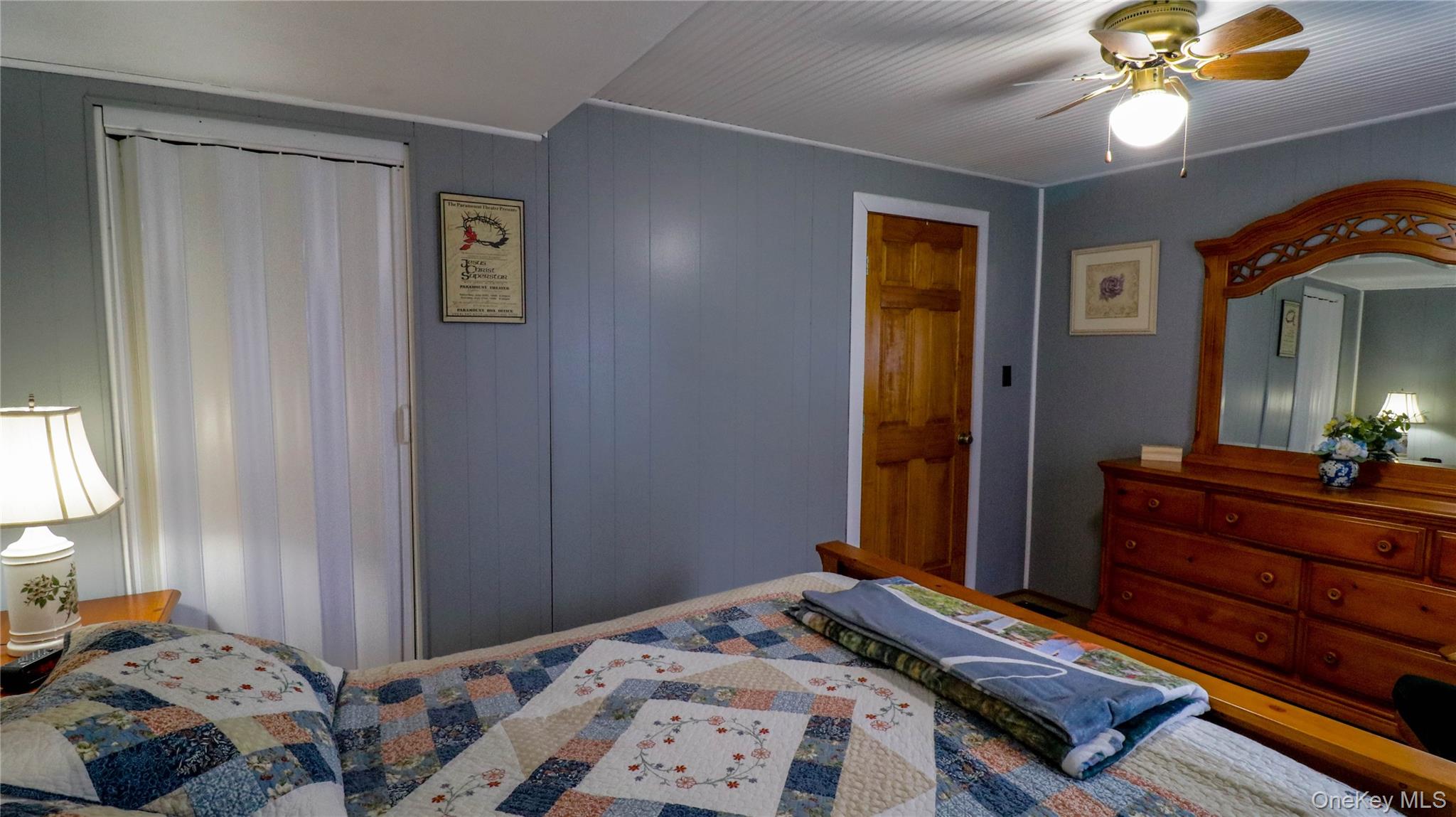11 Hood Road Roscoe, NY 12776 - Photo 14 of 31 Room featuring light gray wall paneling, a wood-finish door, and a white beadboard ceiling
