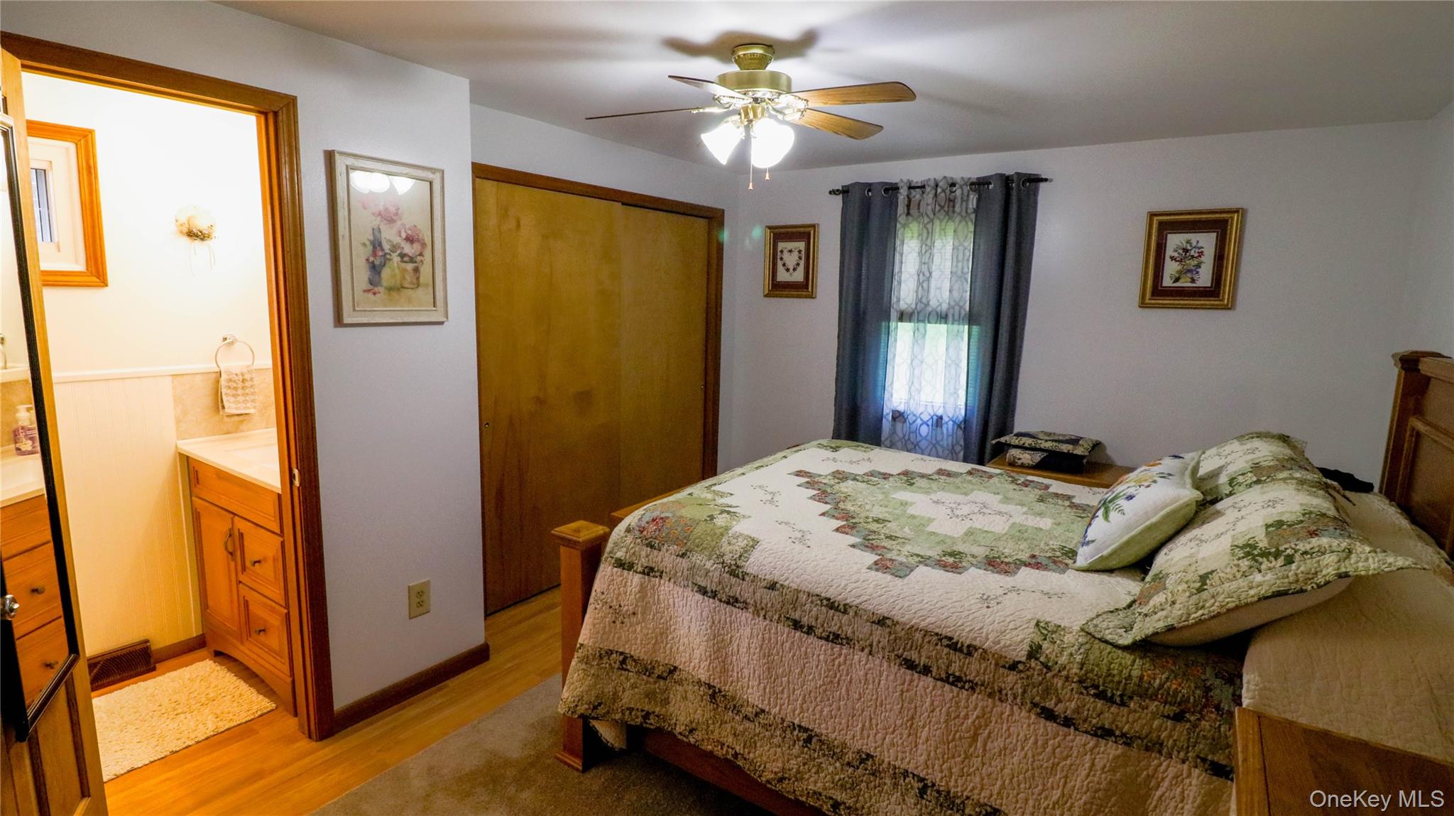 11 Hood Road Roscoe, NY 12776 - Photo 17 of 31 Bedroom featuring hardwood flooring, a ceiling fan, and a window with natural light