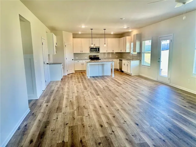 a view of kitchen with wooden floor