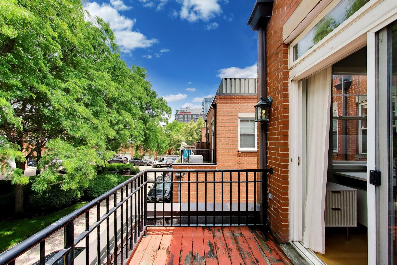 232 West Scott Street Chicago, IL 60610 - Photo 19 of 39 a view of a wooden balcony with an outdoor space