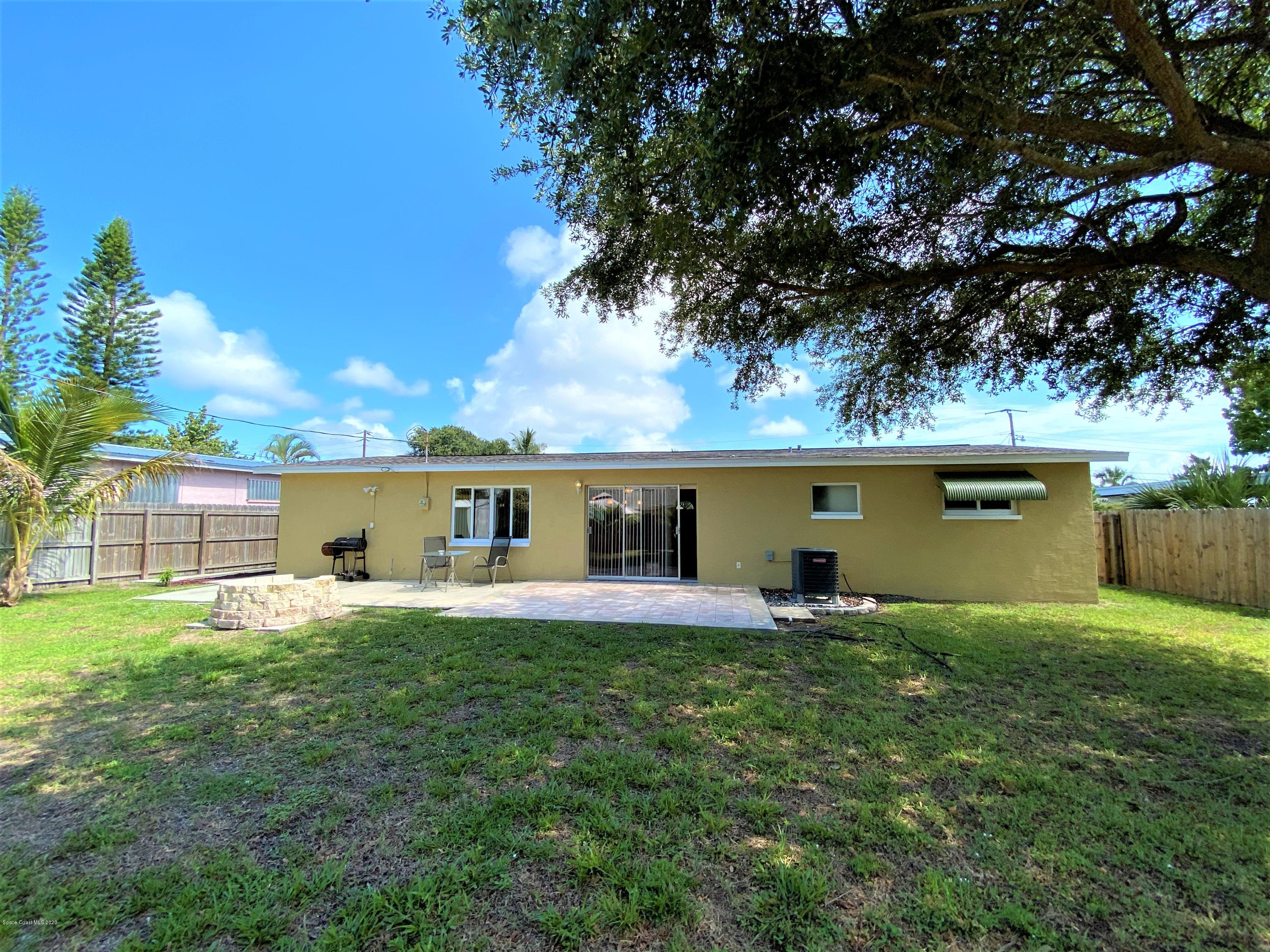 175 Tiki Drive Merritt Island, FL 32953 - Photo 12 of 15 front view of a house with a yard