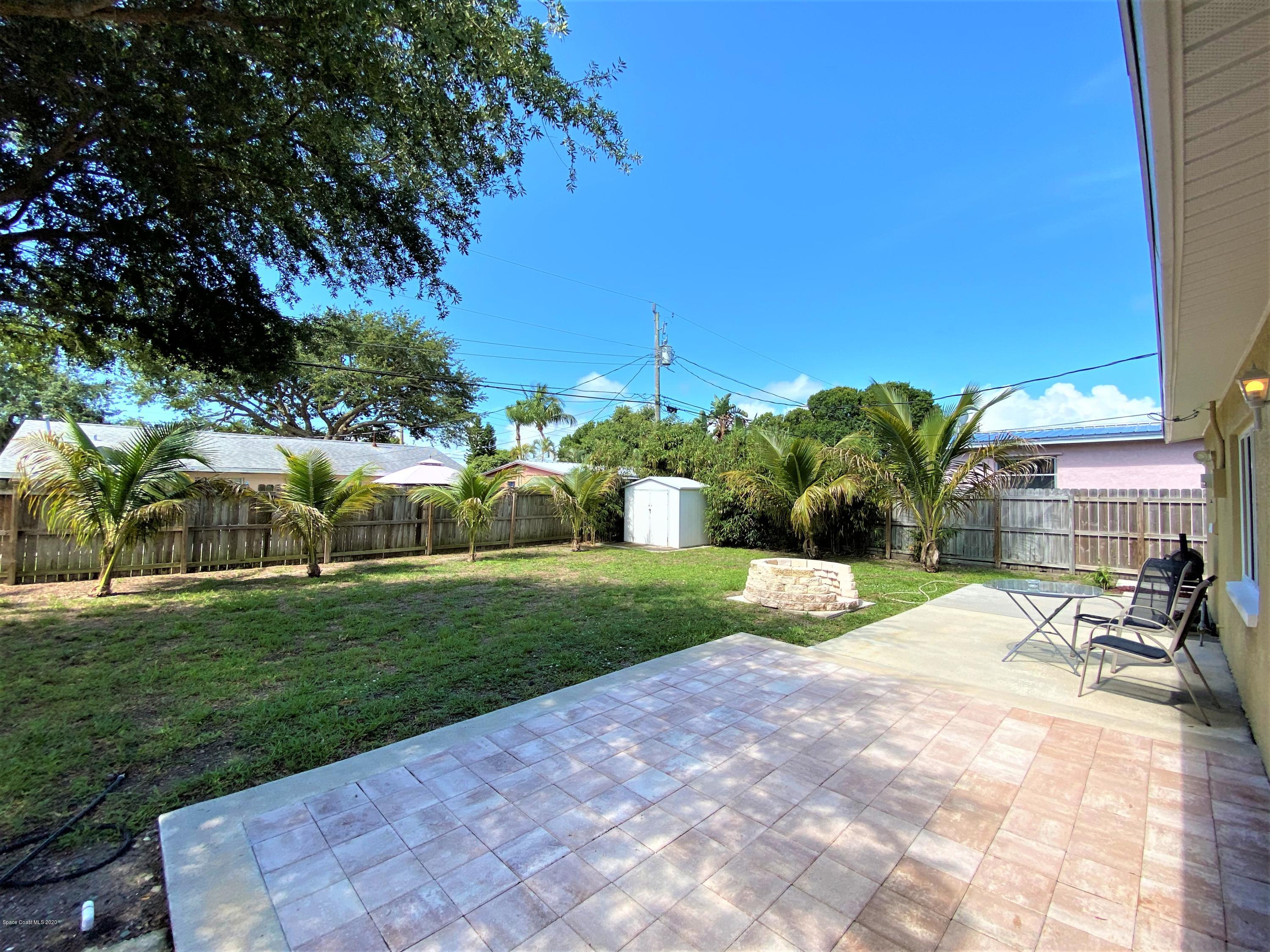 175 Tiki Drive Merritt Island, FL 32953 - Photo 13 of 15 a view of a backyard with plants and patio
