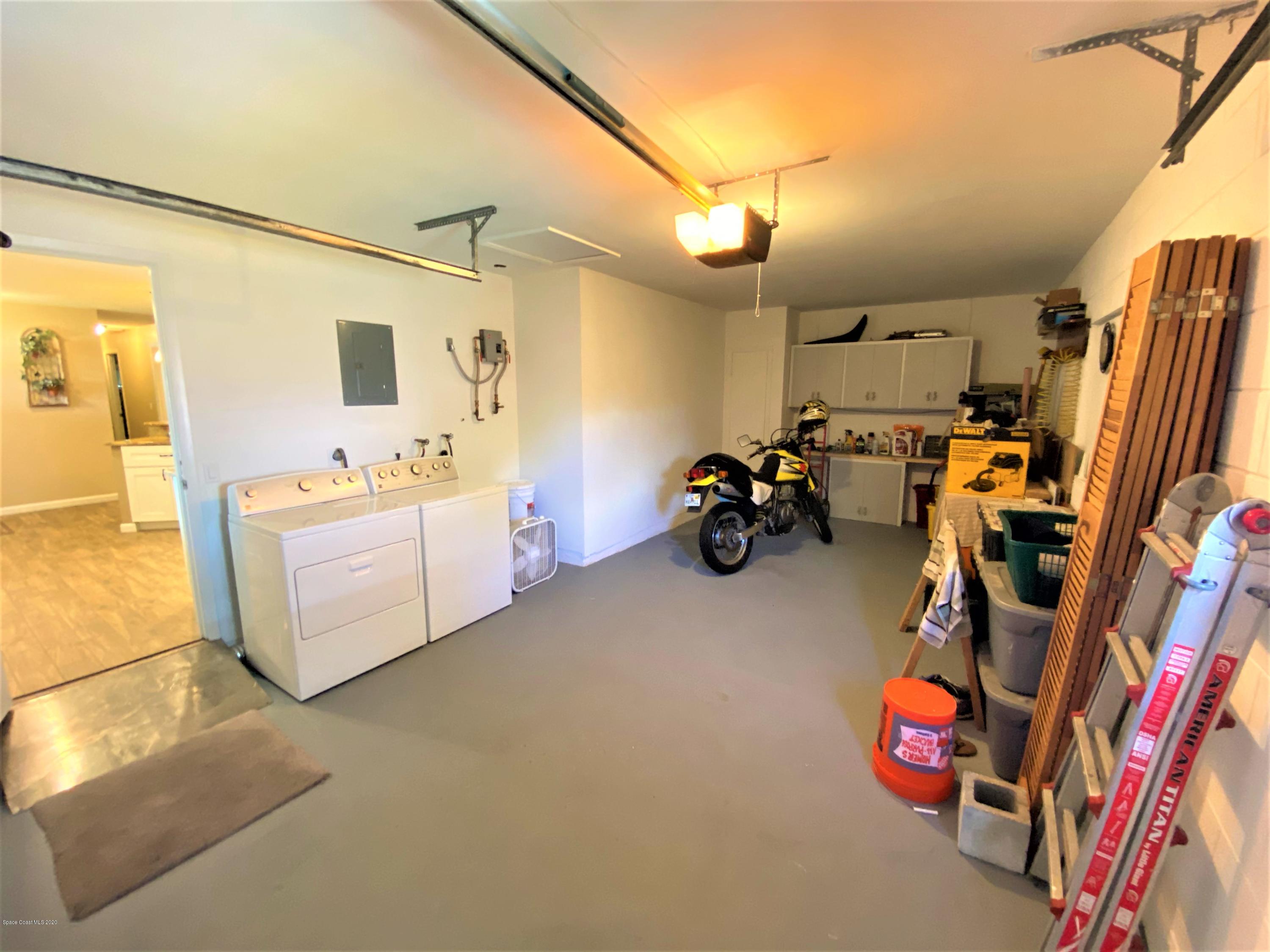 175 Tiki Drive Merritt Island, FL 32953 - Photo 15 of 15 a view of a room with gym equipment