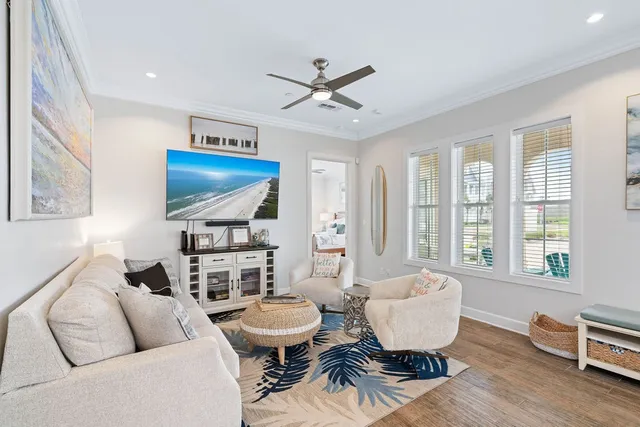 a living room with furniture a rug and a window