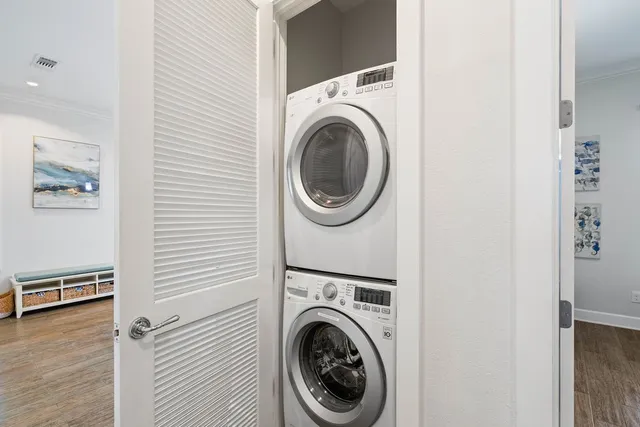 a view of a hallway with washer and dryer