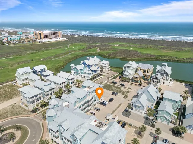 a view of a ocean with furniture