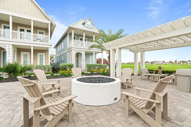 a front view of a house with garden and plants