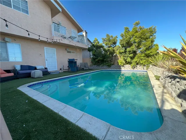 a view of a big yard with potted plants
