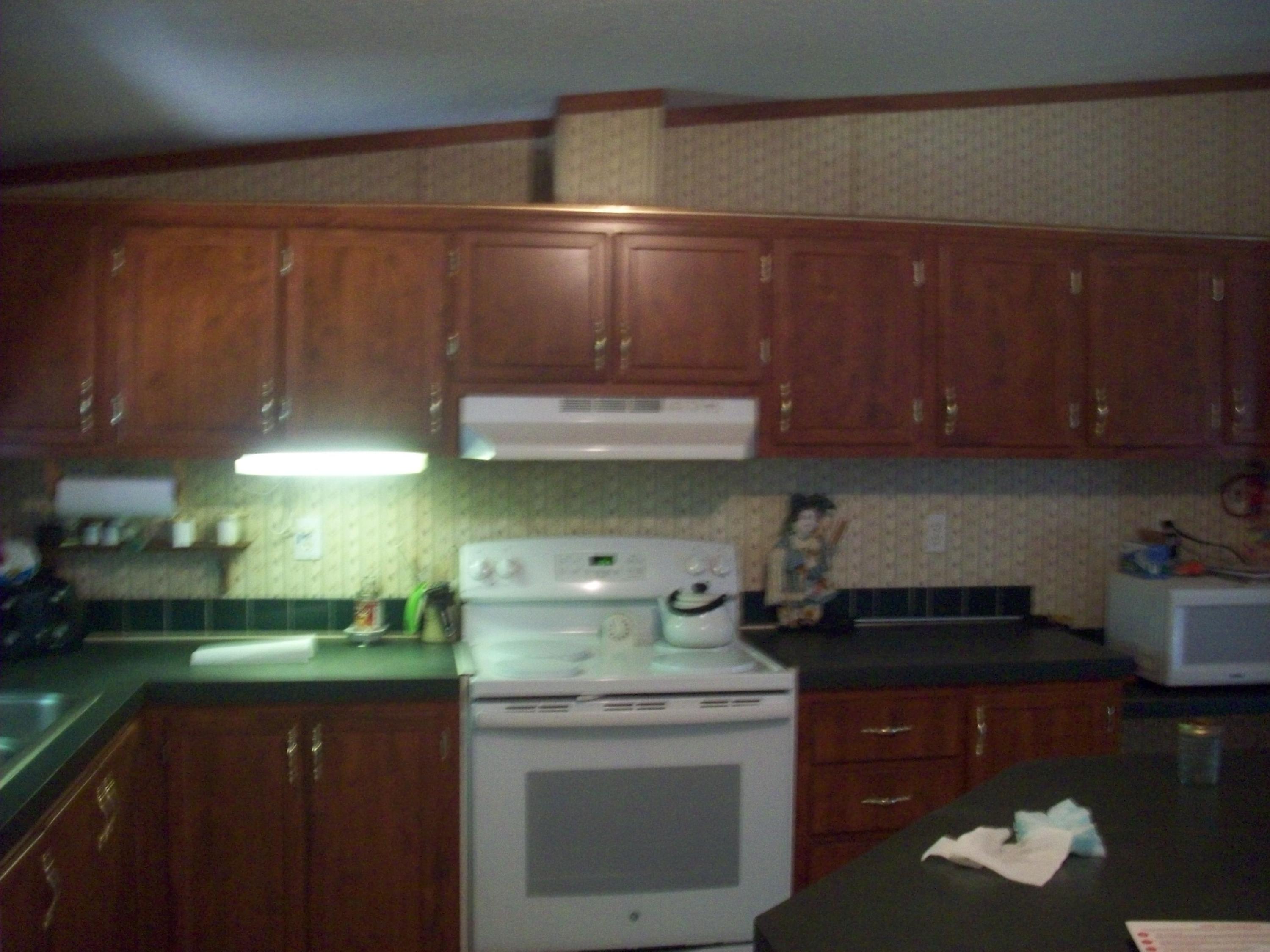 205 Board Mountain Road Goodview, VA 24095 - Photo 2 of 17 a kitchen with a cabinets and a stove