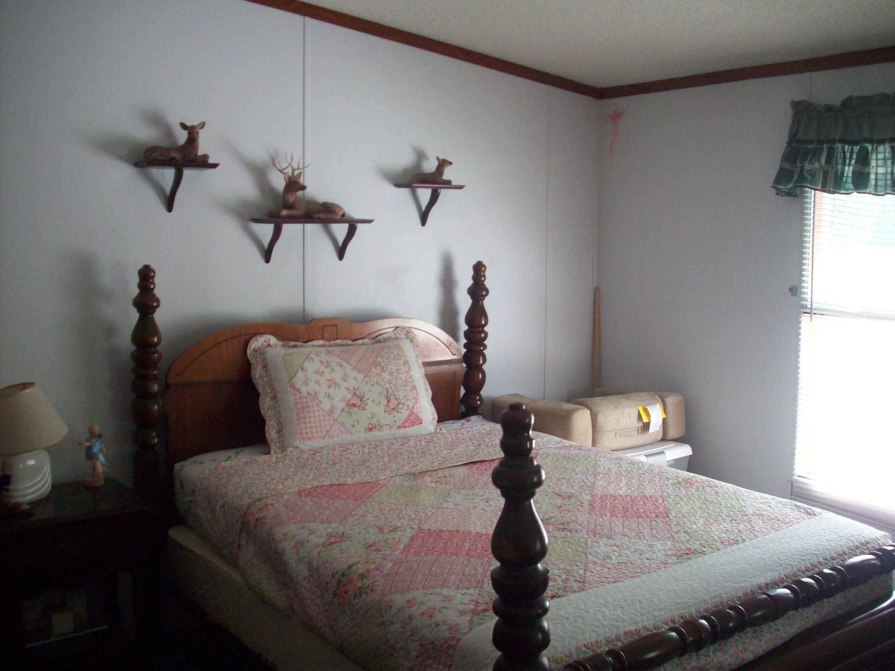 205 Board Mountain Road Goodview, VA 24095 - Photo 12 of 17 a bedroom with a bed and a window